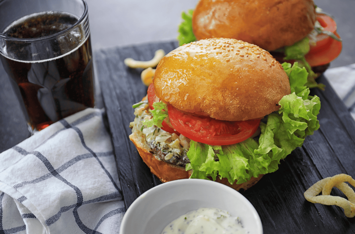 Tasty Turkey Burgers On Wooden Board