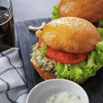 Tasty Turkey Burgers On Wooden Board