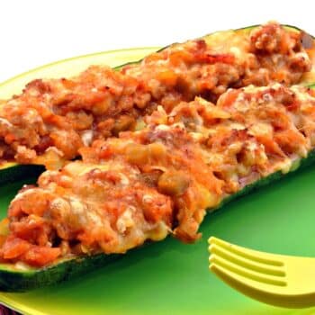 The Best Turkey-Stuffed Zucchini Boat 2 Two Turkey-Stuffed Zucchini Boat On A Green Plate
