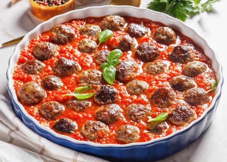 The Best Italian Meatballs With Marinara Sauce Served In A Large Serving Dish