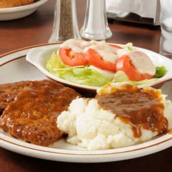 Delicious Cheddar Meatloaf With Mashed Potato And Vegetable Salad On The Side