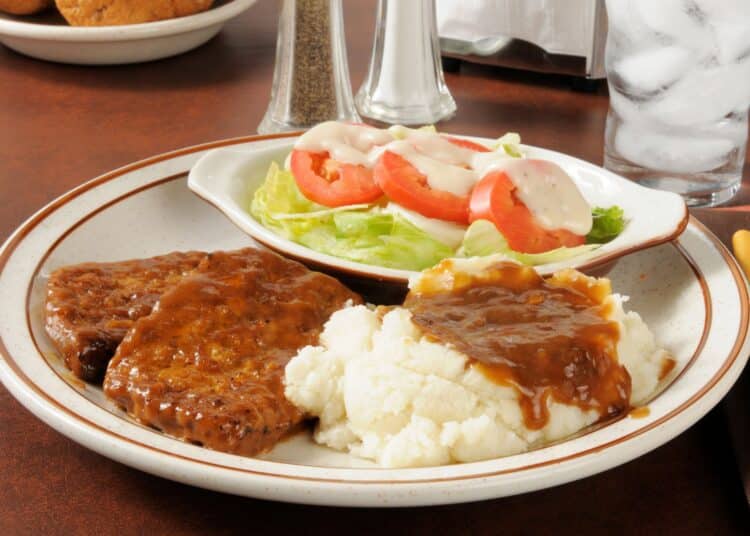 Delicious Cheddar Meatloaf With Mashed Potato And Vegetable Salad On The Side