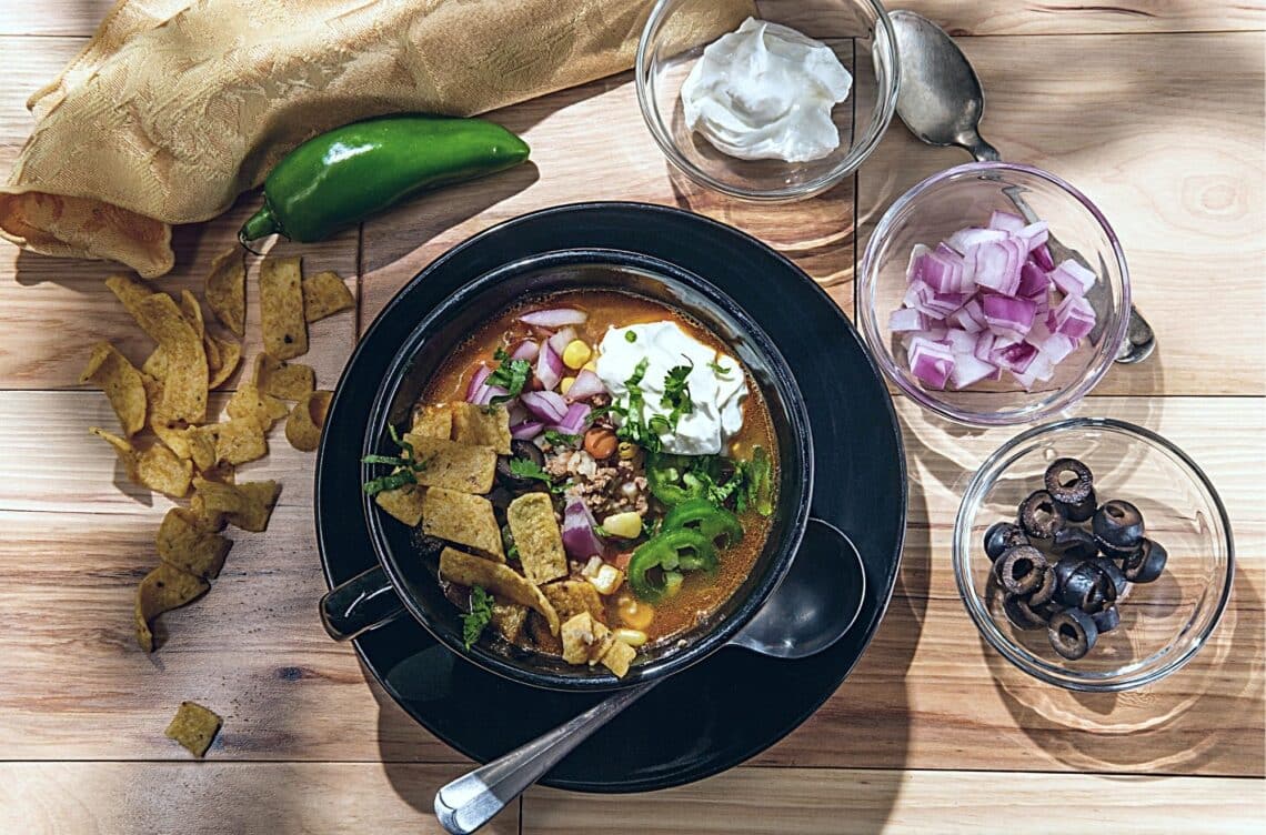 Simple And Delicious Chili Verde 1 Simple And Delicious Chili Verde Served With Onions, Olives, Jalapeno, And Cheese