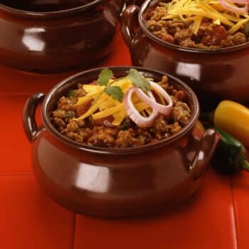 Heartwarming Bbq Bison Chili 2 Heartwarming Bbq Bison Chili With Grated Cheddar Cheese On Top