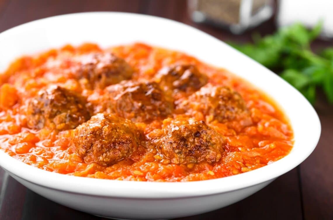 Irresistible Homemade Meatballs In Marinara Sauce In A White Bowl