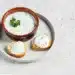 A Bowl And Crostini With Tzatziki Sause