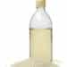 Bottle With Traditional Japanese Rice Vinegar And A Heap Of Rice