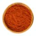 Sweet Pepper Red Paprika Powder In Wooden Bowl Over White