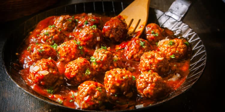 Delicious Meatballs Made From Ground Beef In A Spicy Tomato Sauce Served In A Skillet Or Old Metal Pan In A Restaurant