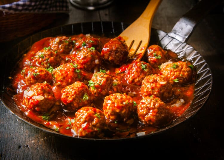 Delicious Meatballs Made From Ground Beef In A Spicy Tomato Sauce Served In A Skillet Or Old Metal Pan In A Restaurant