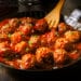 Delicious Meatballs Made From Ground Beef In A Spicy Tomato Sauce Served In A Skillet Or Old Metal Pan In A Restaurant